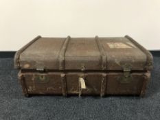 An early 20th century wooden bound travelling trunk