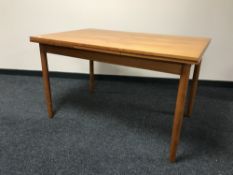 A late 20th century Danish teak extending dining table