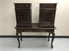 A contemporary hardwood two-drawer console table together with a pair of bedside cabinets with