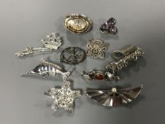 Ten silver brooches (10)