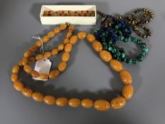 A lapis lazuli bead necklace, a tiger's eye necklace,