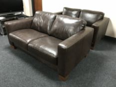 A pair of brown leather two seater settees
