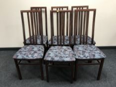 A set of six high backed dining chairs