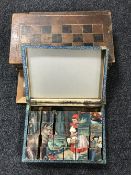 A vintage leather bound chess board in the form of two books,