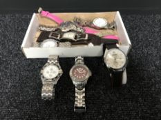 A box containing assorted ladies and gents wristwatches