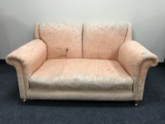An early twentieth century drop-end settee