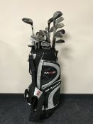 A Dunlop Max golf bag containing irons and drivers