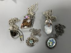 Five silver pendants and chains (5)