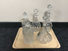 A tray containing five lead crystal decanters,