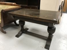 An oak pull out refectory table