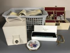 A basket of assorted costume jewellery