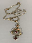 A 9ct gold Art Nouveau garnet set pendant on chain CONDITION REPORT: Good condition.