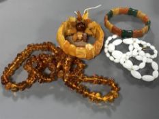 A baltic amber bracelet, together with beads,