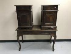 A contemporary hardwood two-drawer console table together with a pair of bedside cabinets with