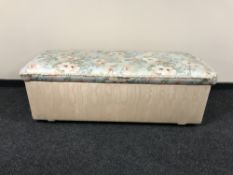 A large pine blanket box upholstered in a floral fabric