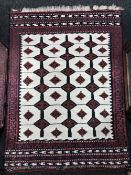 A fringed Turkish Kilim rug