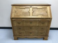 A blonde oak bureau