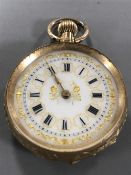 A 14ct gold fob watch with enamel dial, 29.2g gross.