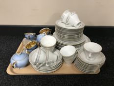 A tray of blue and gilt miniature tea service,