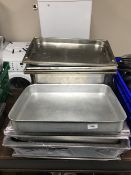 A large quantity of stainless steel bain marie dishes and oven trays