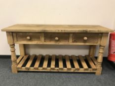 An antique style three drawer dresser base,