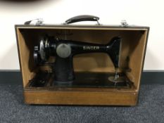 A cased Singer hand sewing machine