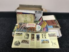 A tray of a good collection of vintage and modern postcards,