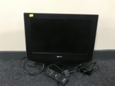 A Sony 17 inch TV with remote together with a box containing assorted CD's