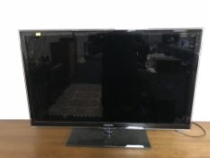 A Samsung EU40D6100 3D LCD TV with remote and two pairs of 3D glasses