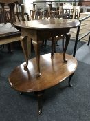 A contemporary walnut oval coffee table and drop leaf table (2)