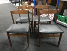 A set of four late twentieth century teak dining chairs
