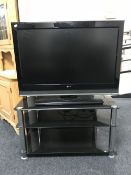 An LG 37 inch LCD tv on stand with lead