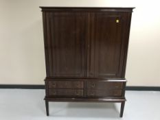 A mahogany double door cabinet