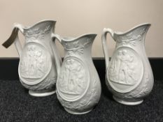 A set of three graduated Classical style jugs