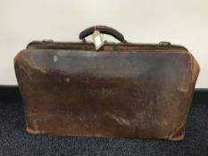 A vintage leather Gladstone bag