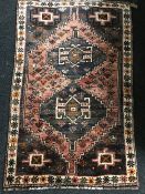 A fringed Persian Shiraz rug