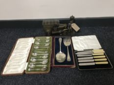 A Ringtons Tea and More to Your Door ornament of three cases silver plated cutlery and servers