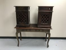 A contemporary hardwood two-drawer console table together with a pair of bedside cabinets with