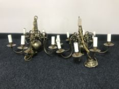 A pair of brass six branch chandeliers