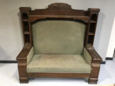 An early 20th century oak framed hall settee