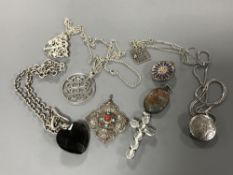 Nine silver pendants and chains (9)