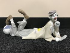A Lladro figure - clown lying down with foot on ball CONDITION REPORT: Good