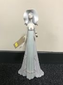 A Lladro figure - a lady in flowing dress,