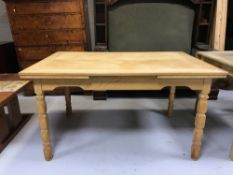 A blonde oak extending dining table