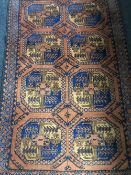 A fringed Afghan Shiraz rug on rust coloured ground