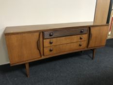 A mid 20th century teak sideboard