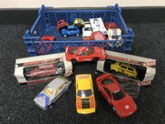 A basket containing a quantity of Scalextric cars