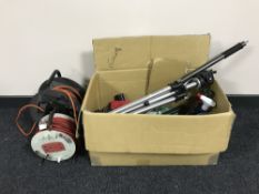 A box of hand tools, fire extinguisher, camera tripod,