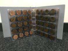 An album containing a quantity of British coinage