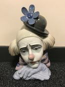 A Lladro figure - clowns head with blue flower on hat CONDITION REPORT: Good